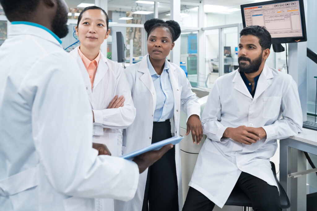 Group of pharmacists in a group, one speaking to the others