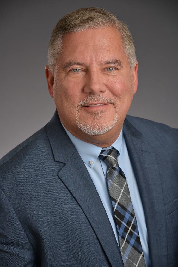 Silhouette of a person with a green band around their head on a green background